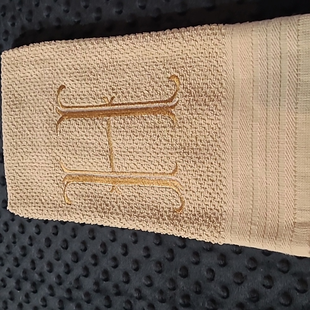 Embroidered H on a tan  dish towel  26 L X 15 1/2 W